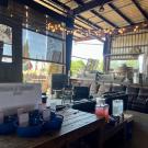 entrance of the event space - couches, sign-in, drinks, string light