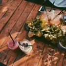wooden picnic table with drinks