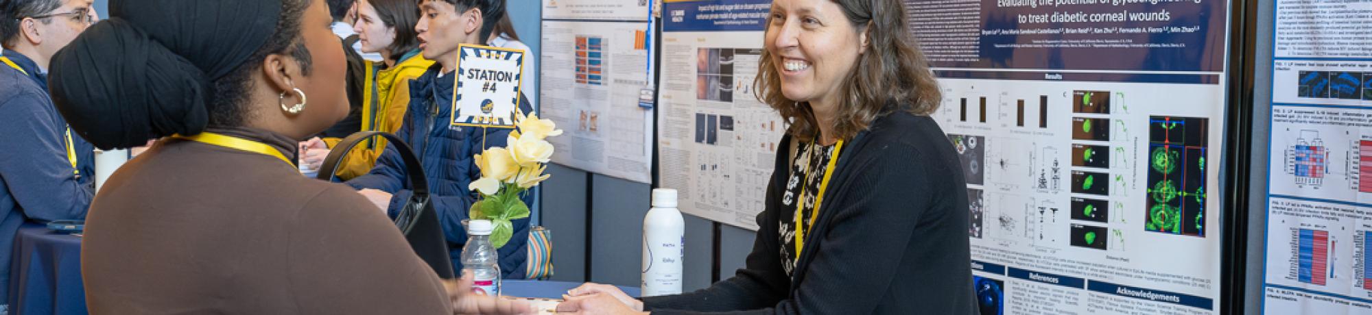 Picture of GGIP Co-Chair, Dr. Sara Thomasy, meeting with prospective students